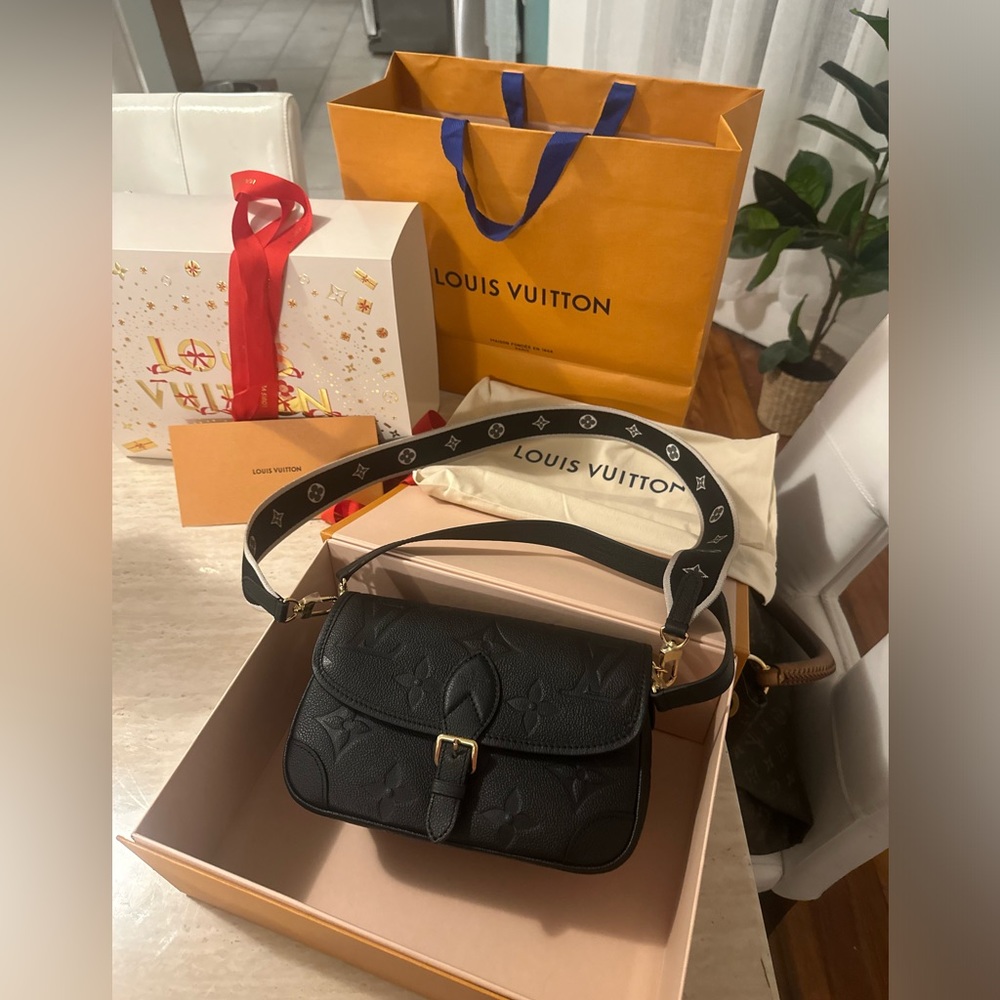 SOLD. Authentic Louis Vuitton Diane Monogram bag in black.